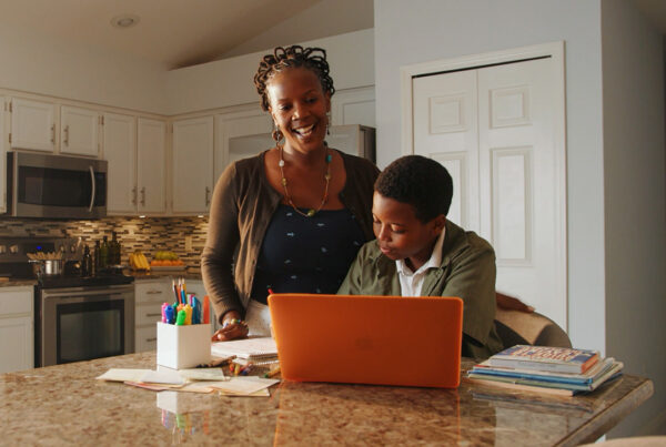 mom and son talking to teacher