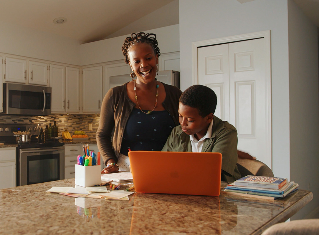 mom and son talking to teacher