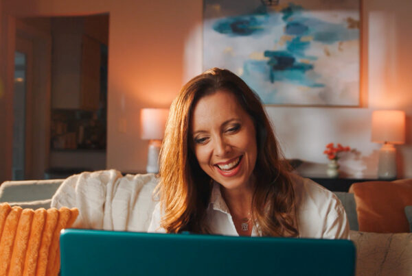 Teacher tutoring virtually in living room