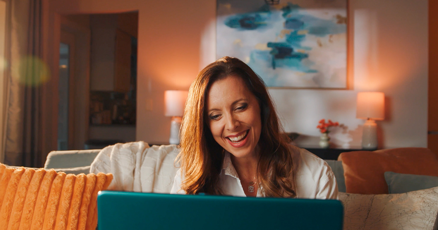 Teacher tutoring virtually in living room
