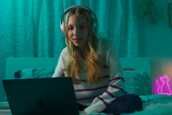 student using computer at home being tutored